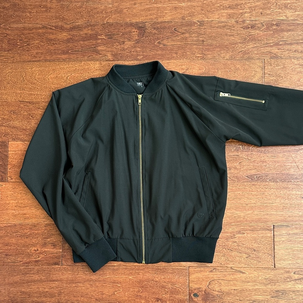 Unworn. Women's Lightweight Black Bomber Jacket with Gold Accents